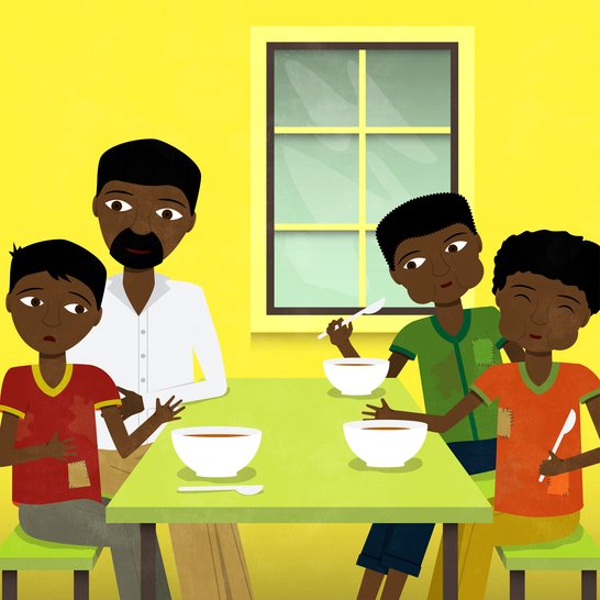 A man sitting at a table with three boys eating.